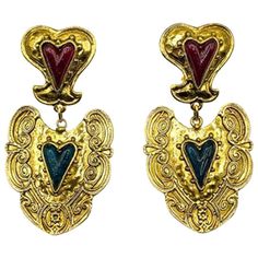 Vintage Heart Drop Earrings. Crafted in gold plated metal, set with elongated resin hearts in dramatic shades of deep red and blue. In very good condiiton, 8cms. A stunning statement earring with fabulous detailing, a hint of romance Should you choose to buy from us, we commit to the item being as described. Your vintage costume jewellery will arrive beautifully packaged and presented, helping to preserve your one of a kind piece. Please take a read through our information below and of course, d Vintage Gold Heart Earrings For Party, Retro Gold Heart-shaped Earrings, Vintage Metal Heart Earrings, Pierced, Vintage Metal Heart Earrings, Red And Blue Heart, Blue Heart Earrings, Resin Hearts, Forever Red, Vintage Drop Earrings