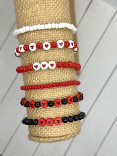 Show your love with these pretty bracelets! Perfect for Valentine's Day! Would make a great gift or a treat for yourself!  ♥️Handmade ♥️Custom Sizing ♥️Two Color Options ♥️Made to Order ♥️3 Bracelets to Stack They are made with: ♥️6mm red OR black round beads ♥️Red beads with black hearts OR white beads with red hearts ♥️4mm red OR white glass seed beads ♥️Stretchy cord for easy wear Buying options: ♥️Black and red bead combo ♥️Red and white bead combo Free shipping on all orders! Friendship Letter Bead Charm Bracelet For Valentine's Day, Valentine's Day Friendship Bracelets With Heart Beads, Casual Bracelets For Valentine's Day Gift, Valentine's Day Heart Bracelet With Letter Beads For Friendship, Cute Beaded Bracelets For Valentine's Day, Cute Beaded Bracelets For Valentine's Day Friendship, Cute Heart Beads Friendship Bracelets For Valentine's Day, Casual Heart Beads Bracelets For Valentine's Day, Casual Charm Bracelet For Valentine's Day Gift