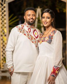 a man and woman standing next to each other