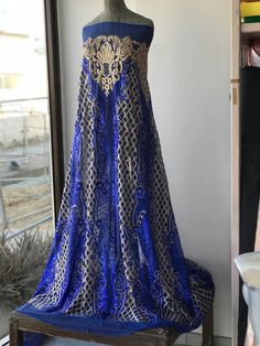 Gold and cobalt blue sequins lace fabric Rich fabric for evening formal gown Width is 135 cm Price is for one yard all order over quantity 1 will be in a continuous length Royal Ball Gown For Banquet, Evening Floor-length Sequin Fabric With Zari Work, Blue Sequined Gown For Banquets, Evening Sequin Fabric With Zari Work, Floor-length, Blue Sequined Gown For Banquet, Elegant Blue Embroidered Sequin Fabric, Elegant Embroidered Blue Sequin Fabric, Royal Blue Sequin Gown For Wedding, Royal Blue Gown For Banquet