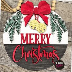 merry christmas sign with bells and pine branches on wood background, hanging from stringed wooden planks