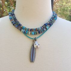 "All the colors of the ocean are combined in this long beaded necklace. Turquoise, lapis, larimar, blue agate and more! Wear this necklace single or double. Beautiful by itself or layer it with your other favorite pieces to create your own color story. Necklace: 37\" plus extender Layer this necklace with: https://www.etsy.com/listing/548308190/turquoise-and-diamonds-pendant-turquoise?ref=shop_home_active_159&frs=1&crt=1 or: https://www.etsy.com/listing/818339679/turquoise-necklace-handk Turquoise Single Strand Beaded Bohemian Necklace, Turquoise Single Strand Beaded Necklace In Bohemian Style, Blue Bohemian Heishi Beads Jewelry, Blue Double Strand Bohemian Turquoise Necklace, Bohemian Double Strand Turquoise Necklace, Bohemian Multi-strand Turquoise Necklace For Beach, Bohemian Blue Double Strand Turquoise Necklace, Artisan Blue Heishi Beaded Necklaces, Artisan Blue Heishi Beads Necklaces