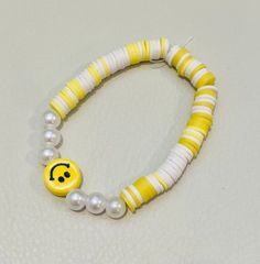 yellow smiley face clay bead bracelet Yellow Round Bead Bracelets For Everyday, Yellow Round Beads Bracelet For Everyday, Yellow Beaded Bracelets For Everyday, Yellow Beaded Bracelets With Round Beads For Everyday, Trendy Smiley Face Stretch Bracelet With Round Beads, Trendy Stretch Bracelet With Smiley Face Round Beads, Yellow Friendship Bracelets With Letter Beads, Trendy Yellow Stretch Bracelet With Round Beads, Trendy Yellow Stretch Bracelet For Everyday