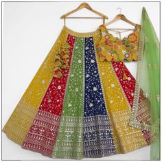 lehenga Anarkali Style Multicolor Sharara With Cutdana, Fitted Multicolor Embroidered Fabric With Mirror Work, Multicolor Mirror Work Sharara For Wedding, Multicolor Traditional Wear With Dori Work, Multicolor Fitted Sharara For Wedding, Fitted Multicolor Sharara For Wedding, Multicolor Lehenga With Zari Work For Wedding, Semi-stitched Multicolor Traditional Wear With Dori Work, Multicolor Kundan Choli With Zari Work