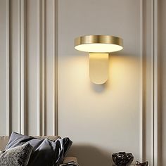 a living room scene with focus on the wall light