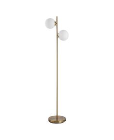 a brass floor lamp with two white balls on it