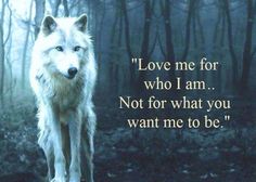 a wolf standing in the middle of a forest with a quote on it's side