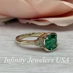 "The ring pictured is lab created emerald and moissanite #6902 Rose Gold is available upon request as a custom order and is a final sale (non refunable, non returnable, non exchangeable). Emerald is the Birthstone for May -Approximate total carat weight: 2.52ctw. diamond equivalent -Center Stone Size: approx. 2.40ct. diamond equivalent -Gem Type: Lab created emerald -Center Stone Shape: cushion cut 8x8mm -Center Stone Color: green, nicest color in emeralds -Center Stone Clarity: VS2 or better -M Green Diamond Ring With Bezel Setting, Green Bezel Set Birthstone Ring For Anniversary, Green Diamond Ring With Bezel Setting, Round Cut, Green Diamond Ring With Bezel Setting In Round Cut, Heirloom Green Diamond Ring With Bezel Setting, Green Birthstone Ring With Bezel Setting For Anniversary, Anniversary Green Birthstone Ring With Bezel Setting, Green Diamond Ring With Bezel Setting For Formal Events, Green Diamond Ring With Bezel Setting For Formal Occasions