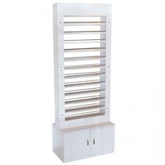 This tall standalone PC02 Nail Polish Rack organization center is the perfect addition to your spa or salon if you're searching for a beautiful and elegant piece. With ample top space for up to 500 nail polish bottles and convenient bottom storage, this Polish Display unit will undoubtedly become the focal point of your spa. This unit is equipped with numerous shelves that allow you to organize your polishes according to brand, color, or other criteria, making it easy to locate them quickly. Add Nail Salon Chairs, Retail Display Shelves, Nail Polish Display, Nail Polish Rack, Polish Display, Nail Salon Decor, Nail Polish Storage, Nail Polish Organizer, Nail Polish Bottles