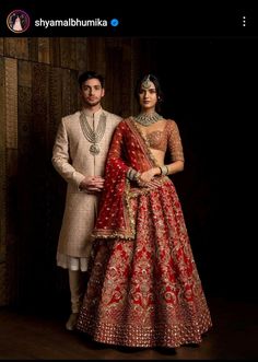 the bride and groom are posing for pictures