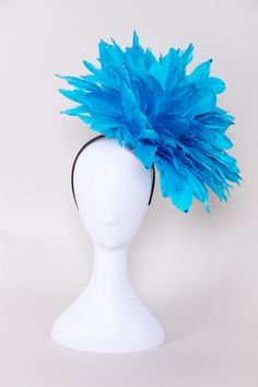 Get ready to party when you wear this fun and fluffy fascinator! Covered in solid bright red-colored feathers and accented with sequins. Pair this with a dress, jumpsuit, or romper for your next event! NO RETURNS/EXCHANGES due to the nature of the product (special occasions and headwear). Not all screens/lighting are created equal. Make sure you are happy with the color match before ordering! If you have any concerns, let us know! All Sales Final on Hats and Fascinators. Colors will vary with di Spring Party Feather Trim Fascinator, Fitted Party Headpiece With Ostrich Feathers, Blue Feathered Fascinator For Summer, Blue Feather Fascinator For Summer, Blue Feathered Summer Fascinator, Blue Feathered Fascinator For Races, Summer Party Feather Trim Fascinator, Blue Feather Fascinator For Races, Summer Party Fascinator With Feather Trim