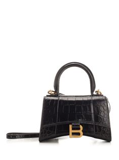 "Hourglass" XS handbag in semi-glossy embossed leather from Balenciaga with top handle, adjustable and removable shoulder strap, magnetic closure with gold B logo and small inside pocket. Balenciaga Tote Bag, Balenciaga Tote, B Logo, Handbag For Women, Best Wallet, Woman Bags Handbags, Black Tote, Wallet Bag, Black Tote Bag