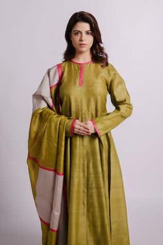 Green full sleeves solid wild silk anarkali with pink patti stitched on neckline and sleeves. Paired with a pencil pant with detailing of tucks and a green colour block wild silk dupatta. - Aza Fashions Long Sleeve Slub Silk Anarkali Set For Festivals, Pista Green Long Sleeve Silk Kurta, Long Sleeve Slub Silk Dress With Zari Work, Bollywood Style Long Sleeve Slub Silk Dress, Pink Long Sleeve Raw Silk Anarkali Set, Anarkali Pista Green Silk Kurta, Navratri Long Sleeve Churidar In Slub Silk, Long Sleeve Dress In Slub Silk With Zari Work, Diwali Long Sleeve Cotton Silk Anarkali Set