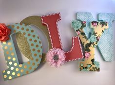 the word love spelled with decorative letters and flowers