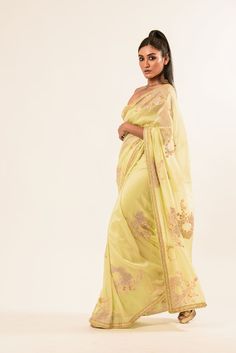 Discover our exquisite light-yellow crepe silk saree. Beautifully soft and detailed with intricate hand embroidery by skilled artisans, it adds elegant sophistication to any ensemble. Yellow Chanderi Saree For Reception, Elegant Pista Green Traditional Wear With Embroidered Border, Yellow Silk Pre-draped Saree For Reception, Yellow Chikankari Embroidery Saree For Reception, Yellow Dola Silk Pre-draped Saree For Reception, Yellow Chikankari Embroidered Dupatta For Reception, Yellow Chikankari Embroidery Dupatta For Reception, Green Embroidered Border Saree For Reception, Gold Saree With Embroidered Border For Reception