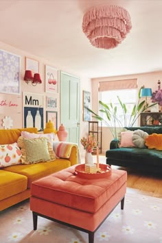 a living room filled with lots of furniture and decor on top of a white floor