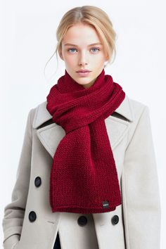 a woman wearing a red scarf and coat