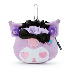 a purple stuffed animal with a black bow on it's head is hanging from a chain