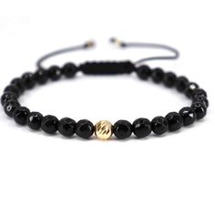 ✨Discover the pinnacle of masculine elegance with our exclusive handcrafted bracelet, featuring bold 6mm faceted black onyx beads, centered with a striking 6mm 14K gold bead and complemented by two 2.5mm 14K gold beads at the adjustable closure. This piece is a testament to timeless style and sophistication. Gold Bracelet Key Features: ✅Superior Craftsmanship: Each bracelet is carefully handcrafted, showcasing the meticulous attention to detail and dedication to quality. ✅Luxurious Materials: Ad Elegant Hand-strung Bracelets, Luxury Adjustable Black Wristband, Luxury Black Adjustable Beaded Bracelet, Modern Black Bracelets With Gemstone Beads, Luxury Black Hand-strung Beaded Bracelets, Modern Black Hand-strung Bracelets, Luxury Black Jubilee Beaded Bracelet, Modern Black Hand-strung Bracelet, Modern Black Jewelry With 8mm Beads