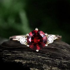 "This is a 1.25 carat garnet engagement ring in solid gold,about 7mm round cut. The accent stones are moissanites,forever classic quality. It can be made in any ring size. However please contact me to custom make it to a special big or small size. It can be made in white gold,rose gold or yellow gold with 14k or 18k. However for some people who are nickel allergic,I can also make it to 925 sterling silver to make you can wear it. The ring is handmade,very high quality! 30 days money back guarant Elegant Garnet Round Cut Rings, Vvs Clarity Ruby Jewelry For Promise, Brilliant Round Cut Lab-created Ruby Jewelry, Elegant Round Ruby Promise Ring, Timeless Garnet Jewelry For Anniversary, Elegant Jewelry With Lab-created Ruby For Promise, Elegant Lab-created Ruby Jewelry For Promise, Vvs Clarity Round Cut Lab-created Ruby Jewelry, Timeless Round Ruby Ring For Gift