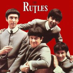 the rutles are posing for a photo in front of a black and white poster