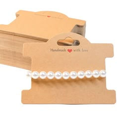 a card with some pearls attached to it