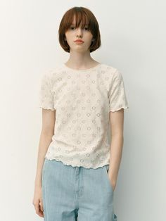 This product is a Wantirna lace t-shirt, which offers a refreshing take on casual wear with its all-over lace design. The t-shirt's classic cut is elevated by the intricate eyelet details, providing a feminine touch. The scalloped hem adds a playful finish to this charming and versatile piece. - The t-shirt is adorned with an eyelet lace pattern, creating a delicate and airy feel.- A round neckline and short sleeves maintain a traditional t-shirt shape, making it easy to incorporate into any wardrobe.- The scalloped hemline enhances the garment with a decorative edge.- Crafted from a lightweight fabric, it's comfortable for all-day wear and perfect for layering or as a standalone piece in warm weather. Eyelet Lace Pattern, Lace Tshirt, Eyelet Lace, Scalloped Hem, Lace Pattern, Lace Design, Lightweight Fabric, Warm Weather, Round Neckline