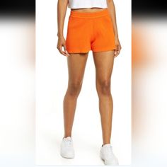 Eadie High Waist Rib Shorts In Orange Combining Sporty Ease With Classic Versatility, These High-Rise Shorts In A Soft Rib Knit Are Ones You'll Choose To Wear Again And Again. Orange Bottoms With Built-in Shorts For Loungewear, Athleisure Shorts For Day Out, Sporty Bottoms For Summer Day Out, Sporty Stretch Shorts For Day Out, Casual Athletic Shorts For Summer Day Out, Cotton Athleisure Shorts For Day Out, Sporty Bottoms With Short Inseam For Spring, Short Athleisure Bottoms For Day Out, Sporty High Waist Cotton Shorts