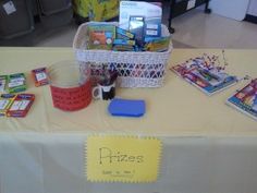 a table that has some books on it and a basket full of cards next to it