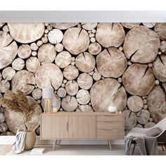 a living room scene with focus on the wall made out of wood logs and chairs