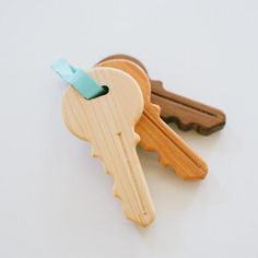 two wooden keys are attached to each other