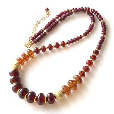 "7268  Garnet Necklace gold accents red orange natural gemstone bohemian statement choker handmade artisan birthday anniversary Christmas holiday gift for her women mom wife girlfriend daughter sister niece aunt grandmother cousin best friend colleague. Enjoy the beauty & power of natural stones.  This listing is for the NECKLACE only  Earrings shown for demo and listed separately at https://www.etsy.com/ca/listing/1608929670/red-orange-garnet-earrings-gold-filled?click_key=01ecdc35ec6361840d67b Festive Gold Necklaces With Natural Stones, Artisan Gold Beads Jewelry For Gift, Red Gemstone Beaded Necklaces For Spiritual Purposes, Bohemian Gemstone Necklaces For Festive Occasions, Adjustable Gold Beaded Necklace With Gemstones, Adjustable Gold Beaded Necklaces With Gemstones, Red Jewelry With Gold Beads For Gifts, Bohemian Necklace With Gold Beads, Orange Jewelry With Gold Beads For Gift