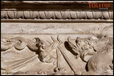 a close up of a stone carving on a building's exterior with the words toto written above it