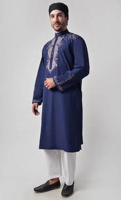 Fabric is 100% cotton Poplin Front button down Mandarin collar Front yoke and sleeves embroidered Length is 42-44" Side Pockets Machine wash cold with like colors and tumble dry Traditional Long Sleeve Kurta With Embroidered Cuffs, Festive Cotton Kurta With Embroidered Cuffs, Eid Long Sleeve Kurta With Embroidered Cuffs, Long Sleeve Kurta With Embroidered Cuffs For Eid, Cotton Kurta With Embroidered Cuffs Long Sleeve, Cotton Kurta With Embroidered Cuffs, Spring Kurta With Embroidered Cuffs And Long Sleeves, Spring Long Sleeve Kurta With Embroidered Cuffs, Festive Cotton Kurta With Embroidered Sleeves