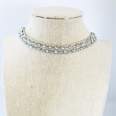 * This handmade sparkling, fancy choker is simple, elegant and so boho.  * Silver ribbon with silver embroidery with sparkle Crystal Love this. * Choker is 13 inches with 2 inches of adjustable extender chain. * Ebriodery choker is so delicate Please Avoid perfumes and lotions and remove before swimming and bathing etc.    Avoid leaving your jewelry in damp environments. * Gently clean with dry cloth and store in the plastic zip bag and box supplied. * Each piece is packaged with love and ready for gift-giving or just for your own beautiful self! Silver Crystal Choker With Chain, Formal Silver Choker With Clavicle Chain, Silver Chain Choker For Formal Occasions, Formal Silver Clavicle Chain Choker, Adjustable Sparkling Rhinestone Necklace, Party Jewelry Choker With Silver Chain, Glamorous Silver Clavicle Chain Necklace, Party Silver Chain Choker Jewelry, Adjustable Rhinestone Choker For Formal Occasions