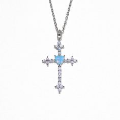 Now trending! Our Serendipity Cross Necklace is a fun twist on a classic design with a dazzling blue gem accent, adding just the right bit of color to your look. A perfect way to show off your unique style! 18k gold plated, 18k rose gold plated, or rhodium plated over brass with a protective coating Cubic zirconia ston Blue Round Pendant Necklace For Party, Dainty Blue Jewelry For Party, Sterling Silver Birthstone Necklaces For Parties, Adjustable Cross-shaped Party Jewelry, Turquoise Gemstone Jewelry For Party, Dainty Gemstone Necklaces For Parties, Turquoise Crystal Jewelry For Gifts, Turquoise Crystal Jewelry Gift, Blue Clavicle Chain Jewelry For Parties