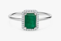 "14k Gold Emerald and Diamond Ring / Solid Gold Diamond Ring / Emerald Engagement Ring / Halo Rectangular Setting / Dainty Emerald Ring ✔ Handmade ✔ Setting Size: 9.5 x 7.5 mm ✔ Diamond Ct Weight: 0.09ctw ✔ Emerald Ct Weight: 1.15 All our emeralds are treated natural emeralds (Emeralds are typically treated with oil or other \"fillers\" to draw the filling substance into any surface-reaching fissures to improve the clarity of the emerald) ✔ Band Thickness: 1.2mm ✔ Solid Gold ✔ Natural Diamonds a Green Ring With Halo Design For Anniversary, Green Halo Design Ring For Anniversary, Green Diamond Jewelry With Rectangular Stone, Green Radiant Cut Ring With Accent Stones, Green Radiant Cut Rings With Accent Stones, Radiant Cut Green Rings With Accent Stones, Anniversary Rings With May Birthstone In Rectangular Shape, Rectangular Emerald Ring With Halo Setting, Classic Green Emerald Ring With Rectangular Stone