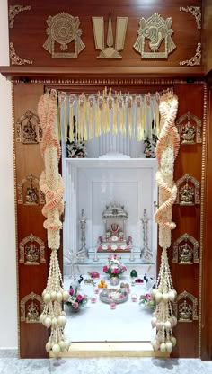 an elaborately decorated stage set up with flowers and candles for a wedding or special occasion