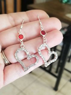 New Handmade  Sterling Silver Cubic Zirconia Heart Earrings ♡ Sterling silver cubic zirconia heart charm earrings ♡ .925 Sterling silver hook back ♡ Red crystal accents  ♡ Measure 2 inches long ♡ Lightweight  ♡ Hypoallergenic (nickel free) Thank you for checking out my online store. I ship within 24 hours of cleared payment Monday-Saturday Anniversary Heart Beads Dangle Earrings, Nickel-free Dangle Earrings For Valentine's Day, Heart Beads Drop Earrings For Anniversary, Valentine's Day Nickel-free Dangle Earrings, Nickel-free Heart Pendant Earrings For Valentine's Day, Pierced Heart Drop Earrings For Valentine's Day, Heart-shaped Crystal Earrings For Valentine's Day, Valentine's Day Heart Earrings For Jewelry Making, Valentine's Day Hypoallergenic Double Heart Earrings