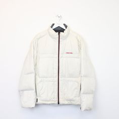 SKU - CG6973   Vintage Polo Ralph Lauren puffer jacket in white. Best fits L  DETAILS: ▫️ Full zip up  ▫️ Front logo  ▫️ Pockets     👕 Fits like a ~ L ▫️ Label states ~ L ▫️ Pit to Pit ~ 23.5" ▫️ Length ~ 26" ▫️ Pit to Cuff ~ 21"   👇 If any defect is found and it is not included in the provided photos, it will be listed below. ▫️     🧺 All items are professionally washed and ironed before photos are taken and then sold.    ✅ If the item is listed, it is available    ❌ Disclaimer: Like all vin White Sporty Quilted Outerwear, Sporty White Quilted Outerwear, White Hooded Quilted Puffer Jacket, White Nylon Urban Puffer Jacket, White Puffer Jacket For Winter Streetwear, Casual Winter White Puffer Jacket For Streetwear, White Urban Puffer Outerwear, White Hooded Puffer Jacket For Streetwear, White Down Puffer Outerwear