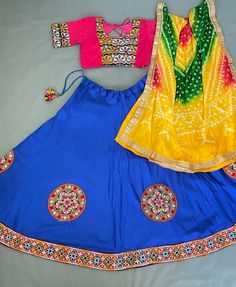 *🌷Lehenga choli🌷* *Lehenga(Stitched)* Lehenga Fabric : Cotton  Lehenga Work : Embroidered Aari Work Patches (Lace Border)  Lehenga Closer : Drawstring and tassels  Lehenga Waist : Support Up To 42  Length : 41 Flair : 4 Meter Inner : Micro Cotton *Blouse(Stitched)* Blouse Fabric : Cotton  Blouse Size:  38"( There Is a extra two inch Margin so Customer Can Adjust Upto 36 To 42) Blouse Work : Embroidered Aari Work Patches  Blouse length : 15" Sleeve Length : 20" *Dupatta* Dupatta Fabric : Leheri Fitted Bollywood Lehenga With Motifs, Cotton Lehenga With Unstitched Blouse For Diwali, Fitted Multicolor Traditional Wear With Bandhani Print, Fitted Bohemian Anarkali Set With Bandhani Print, Bohemian Bandhani Print Fitted Choli, Navratri Lehenga With Multicolor Embroidery And Unstitched Blouse, Diwali Festival Lehenga With Unstitched Blouse, Festive Multicolor Lehenga With Motifs, Fitted Saree Set For Festival