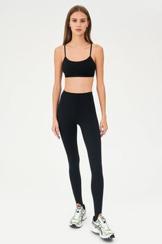 Our famous, form fitting high waist legging redesigned as a stirrup tight. Our ultra luxe Airweight fabric has a supremely soft hand and second skin comfort. BEST FOR: hot yoga, barre, Pilates. Model is 5'10" and wears a size small. Sleek Yoga Activewear With Built-in Bra, Sleek Activewear With Built-in Bra And Stretch, Sleek Activewear With Built-in Bra, Fitted Tights With Light Support For Pilates, Compressive Activewear With Built-in Bra For Barre, Sleek Seamless Stretch Activewear, Fitted Light Support Tights For Pilates, Sleek Compressive Leggings For Pilates, Black Seamless Tight Activewear