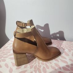 New Size 39.5 Geometric Side Cutouts And A Square Toe Lend Contemporary Dimension To A Smooth Leather Boot Lofted By A Stacked Block Heel. Adjustable Buckle 3" Heel Fall Leather Heels With Heel Strap, Leather Heels With Heel Strap For Fall, Chic Leather Shoes With Almond Toe, Chic Brown Leather Shoes With Round Toe, High Heel Leather Shoes For Spring, Brown Calf Leather Heels With Buckle Closure, Chic Closed Toe Leather Shoes With Branded Heel, Brown Leather Shoes With Branded Heel Counter, Chic Leather Shoes With Branded Heel Counter