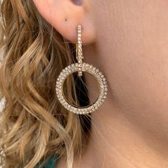 Brilliant cubic zirconia catches the light with every movement in this double loop statement earring. Elevate your jewelry collection with this versatile earrings that effortlessly transition from day to night. Double loop with Pave CZ Post Back Clip Chic Hoop Earrings With Cubic Zirconia, Chic Cubic Zirconia Hoop Earrings, Chic Cubic Zirconia Single Earring, Chic Single Cubic Zirconia Earring, Cubic Zirconia Drop Earrings With Bling, Cubic Zirconia Bling Drop Earrings, Modern Jewelry With Rhinestones And Cubic Zirconia, Modern Cubic Zirconia Jewelry With Rhinestones, Diamond White Chandelier Earrings