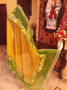 This lehenga is made in dupion silk with full handwork thread embroidery. The dupatta of this outfit has 2 options, one with Single color with single border embroidery( as on model) and Second option with double colour with 2 Borders of embroidery (as on dummy). Luxury Silk Dupatta With Multicolor Embroidery, Luxury Kundan Dupatta For Designer Wear, Luxury Yellow Dupatta For Party, Luxury Green Cutdana Dupatta, Luxury Festival Dupatta With Motifs, Luxury Celebration Dupatta With Self Design, Luxury Traditional Summer Dupatta, Luxury Yellow Dupatta With Printed Motifs, Luxury Dupatta With Peacock Design For Festivals