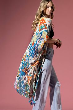 Discover the epitome of style in our trendsetting kimono - A seamless blend of gentle texture, enriched with beautiful leopard and ethnic patterns. Embrace the allure of the unique mix and let the colorful tassels add a playful touch. This gorgeous piece, with its special texture, adds a special dimension to your collection. It's not just great, it's exceptional - a stunning testament to your unique style. 100% Viscose *APPROX. L 38" W 40" Hippie Multicolor Kimono With Kimono Sleeves, Multicolor Hippie Kimono With Kimono Sleeves, Multicolor Boho Print Hippie Kimono, Hippie Multicolor Boho Print Kimono, Multicolor Vacation Kaftan With Tassels, Bohemian Long Patterned Kimono, Multicolor Tasseled Kaftan For Vacation, Multicolor Tassel Kaftan For Vacation, Hippie Multicolor Kaftan With Kimono Sleeves