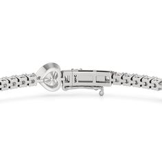 A picture of romance and indulgence. This diamond tennis bracelet is comprised of round diamonds, each on claw prongs, forming a straight but flexible line. Several heart-shaped diamonds, each secured by a bezel, sit at evenly spaced stations, breaking the line with its impressive brilliance. Heart Cut Tennis Bracelet With Diamond Accents For Anniversary, Diamond Heart Bracelet With Brilliant Cut, Anniversary Tennis Bracelet With Diamond Accents, Anniversary Heart Cut Tennis Bracelet With Diamond Accents, Diamond Heart Cut Bracelet With Brilliant Cut, Diamond Heart Cut Brilliant Bracelet, Heart-shaped Brilliant Cut Diamond Bracelet, Diamond Tennis Bracelet With Heart Cut For Anniversary, Diamond Heart Cut Tennis Bracelet For Anniversary