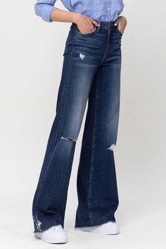 Elevate your denim game with these Flying Monkey High Rise Distressed Wide Leg Jeans. These jeans boast a high-rise waist for a flattering silhouette, while the wide leg design adds a touch of retro elegance. The distressed detailing infuses an edgy element, making these jeans a versatile choice to effortlessly combine modern trends with a hint of vintage-inspired style.F. Rise: 10"Inseam: 34'' Leg Opening: 22''Model is 5' 8'' Wearing size26Fabric Contents: 93% Cotton, 5% Polyester, 2% Spandex, High Rise Denim Flare Jeans For Fall, Fall High Rise Denim Flare Jeans, Fall High-rise Denim Flare Jeans, High Rise Flare Jeans For Fall, Mid-rise Dark Wash Wide Leg Pants For Fall, Fall Medium Wash High Rise Wide Leg Pants, Fall High Rise Medium Wash Wide Leg Pants, High Rise Dark Wash Flare Jeans, Casual Mid-rise Wide Leg Pants With Frayed Hem