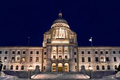 the state capitol building is lit up at night