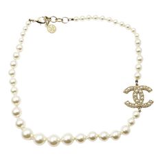 Chanel Gold CC Pearl Short Pearl Necklace 100 Year Anniversary  *Marked 21 *Made in France-It is approximately 18" long.  -The cross pendant is approximately 1.1" x 0.9". -100 year anniversary Gold Pearl Jewelry Necklace Tiffany & Co., Pearl Necklace Chanel, Formal White Gold Necklace With Logo Charm, Classic Formal Jewelry With Logo Charm, Luxury Formal Necklace With Logo Charm, Luxury Necklace With Logo Charm For Formal Occasions, Classic Round Necklace With Logo Charm, Elegant White Jewelry With Logo Charm, White Formal Jewelry With Logo Charm